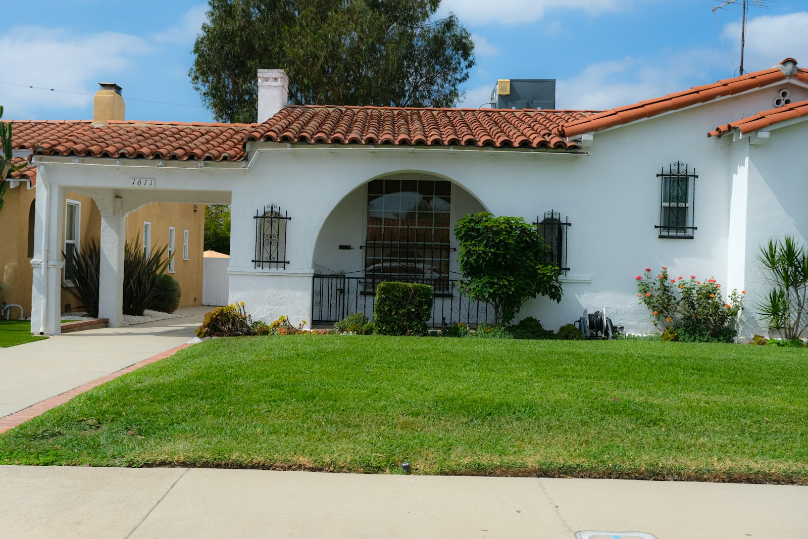 Stucco home with tile roof and a finished desert front yard, far-west Maricopa